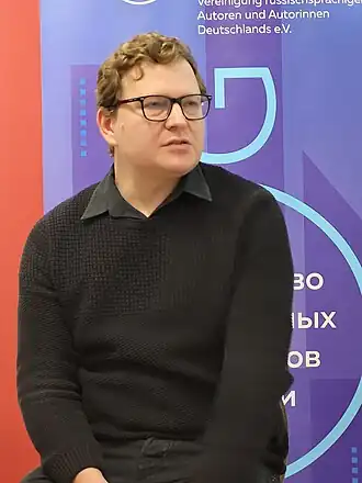 Даниил Бендицкий на чтениях Содружества русскоязычных литераторов Германии (СЛоГ)  9 декабря 2023 года в Берлине