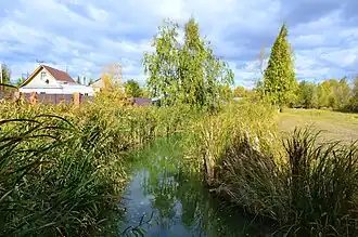 Дренажный канал в районе жилой застройки посёлка Отары