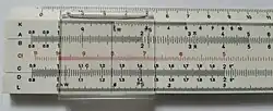Фотография советской логарифмической линейки с пятью шкалами