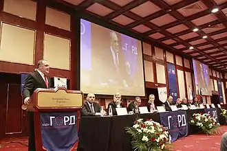 Славчо Бинев (крайний слева, выступает с трибуны)