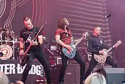 Alter Bridge выступает на Rock am Ring в 2017 году. Слева направо: Скотт Филлипс, Брайан Маршалл, Майлз Кеннеди и Марк Тремонти.