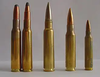 Два патрона 7×57 мм — слева (рядом с 7,5×55 мм Schmidt Rubin, .308 Winchester и .223 Remington