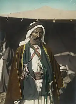 Раскрашенное фото Ауды ибу Тайи, сделанное, предположительно, Эриком Матсоном (1888-1977). Амман, 1921 год.