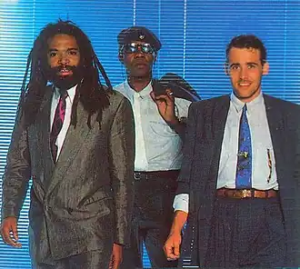 «Золотой» состав Bad Boys Blue (1984—1989). Участники (слева направо): Тревор Тэйлор, Джон МакИнерни[англ.] (передний план) и Эндрю Томас (задний план)