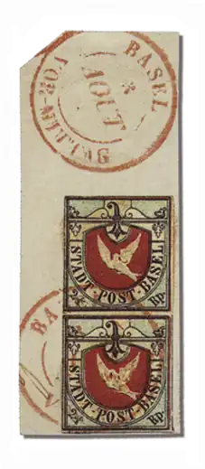 Вертикальная сцепка «Базельской голубки» с ошибкой «Haube auf Taube» и почтовым штемпелем «BASEL 3 AOUT VOR-MITTAG» — единственным известным гашением «до обеда» («VOR-MITTAG»). Продана на 96-м аукционе Corinphila в марте 1997 года за &&&&&&&&&0170000.&&&&&0170 000 швейцарских франков