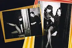 A collage of two black-and-white images with brighty colored borders in a black background. The first picture features a brunette woman, wearing a black dress and fishnet stockings and leaning suggestively against a confessional. A young priest sits on the other side of the partition. The second image shows the same brunette woman sitting on the priest’s lap.