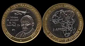 Монета в 3 Африки, посвященная визиту Иоанна Павла II
