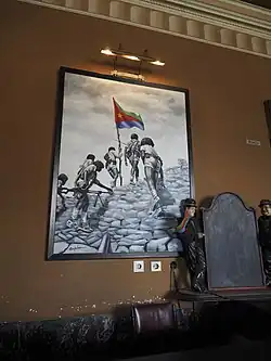 Photographie d’une affiche patriotique encadrée.