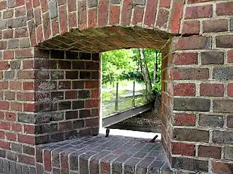 Вид через амбразуру на мост и ров.