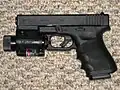 Glock 23 с тактическим фонарём и ЛЦУ