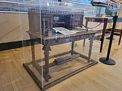 The Grinnell desk in a glass display case