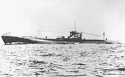 A large submarine underway. Japanese flags and the number «176» are painted on the fin.