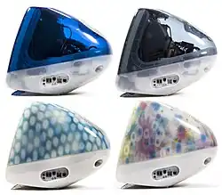 Side view of four iMacs, in clear dark blue, grey, blue with light circle spots, and multicolored flowers screened on its surface.