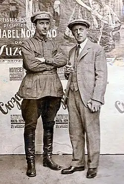 Инженер С. Ильин у афиш немых фильмов кинотеатра, 1929