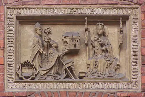 Барельеф, изображающий краковского епископа Збигнева Олесницкого как основателя бурсы Ягеллонского университета, посвящённой младенцу Иисусу