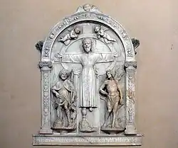 Volto Santo в окружении святых Роха и Себастьяна. 1529. Мрамор. Церковь Сан-Пьетро, Монтемарчелло