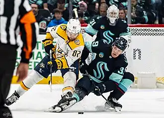 Новак (слева) в 2024 году