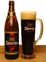 Бокал и бутылка с классическим чёрным пивом Köstritzer