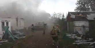 НМ ЛНР штурмует частный сектор Лисичанска 14 июня 2022 года.