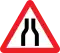 Road narrows on both sides