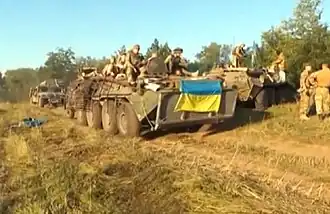 БТР-80 и «Хамви» 95-й аэромобильной бригады в зоне АТО, август 2014 год